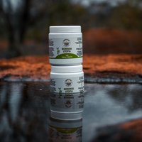 Moringa Utopia 500mg moringa tablets beside a glass of water