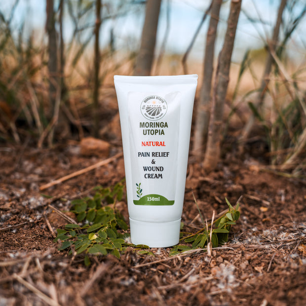 Moringa Utopia botanical cream tube on a natural outdoor background