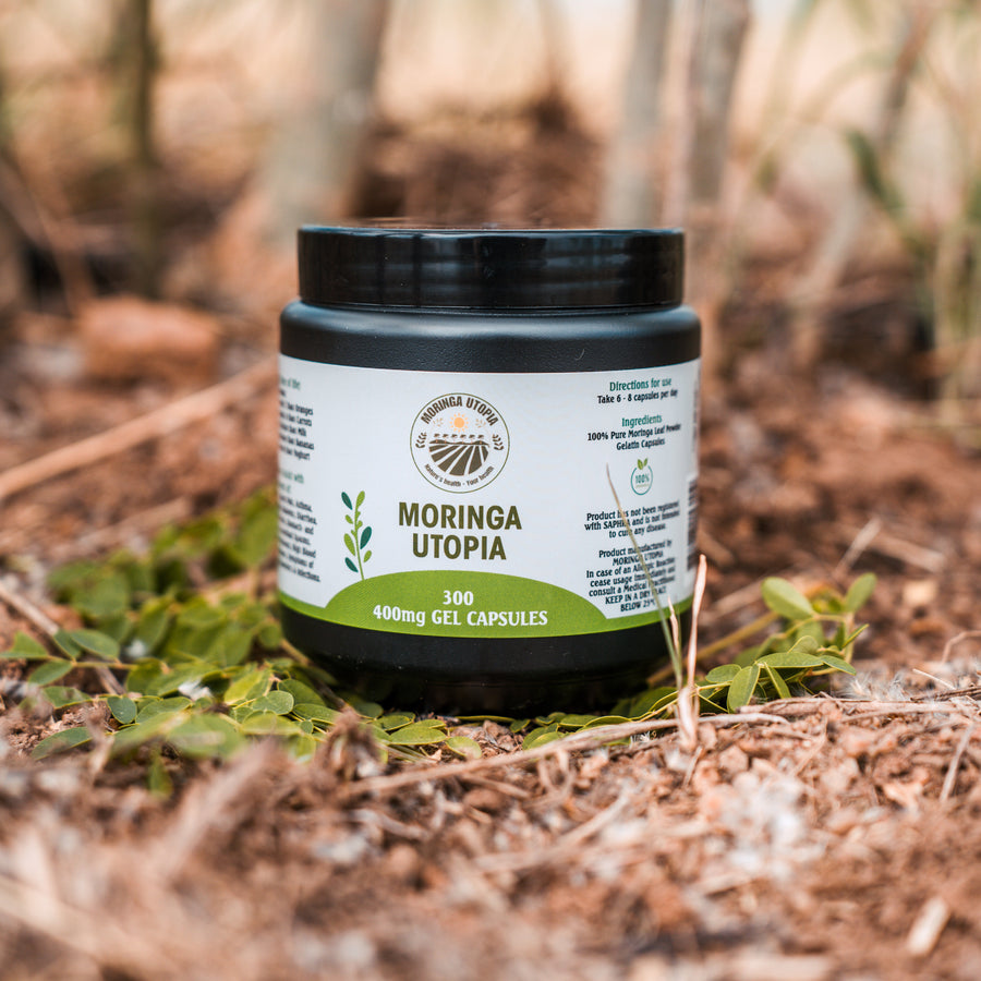 Moringa Utopia 400mg capsules jar in a natural setting