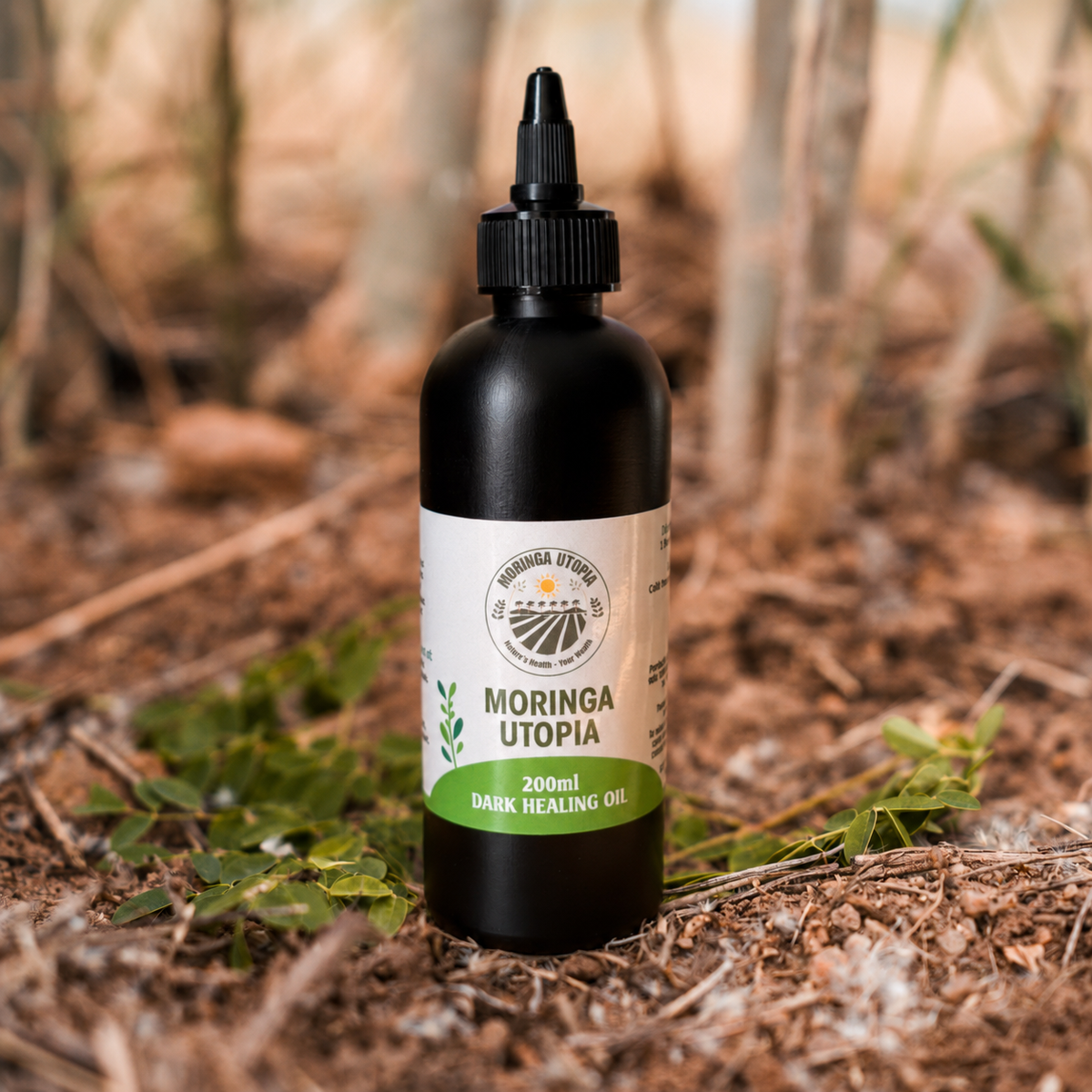 Moringa Utopia 200ml Dark Oil in a plastic bottle with a twist-open nozzle, on the farm in Mookgopong