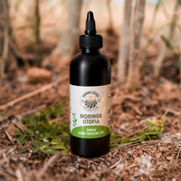 Moringa Utopia 200ml Dark Oil in a plastic bottle with a twist-open nozzle, on the farm in Mookgopong